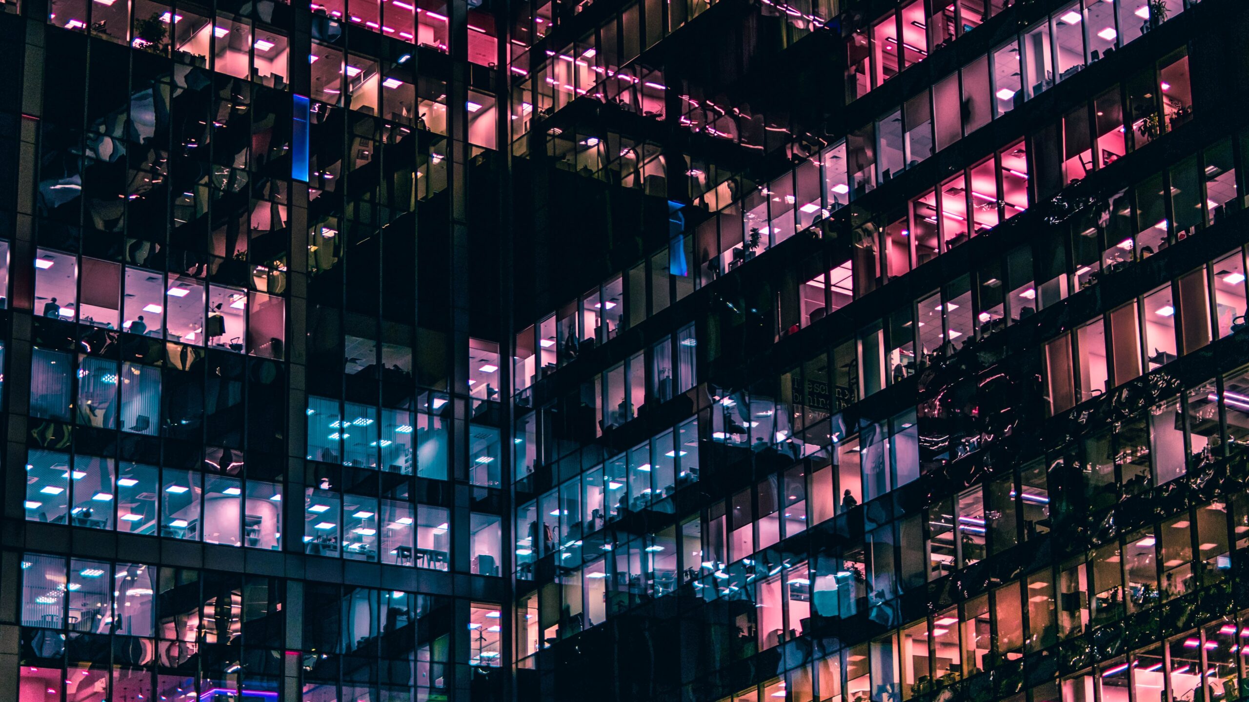 An office building with multi-colored panels on the outside